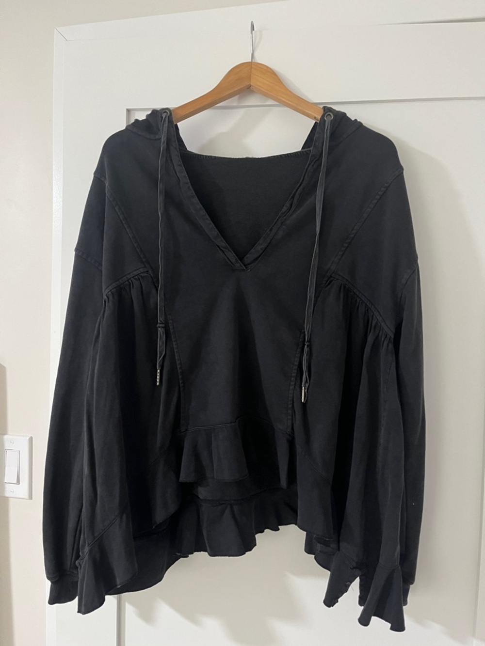 Anthropologie Black Ruffle-Hem Hooded Top
